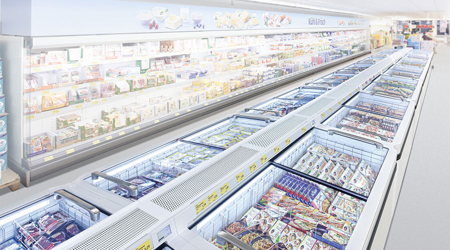 What color changes do foods have in commercial refrigerators and freezers?