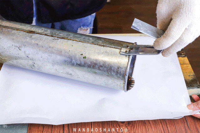Grilled fish shop - shovel served and grilled fish with a steel tube