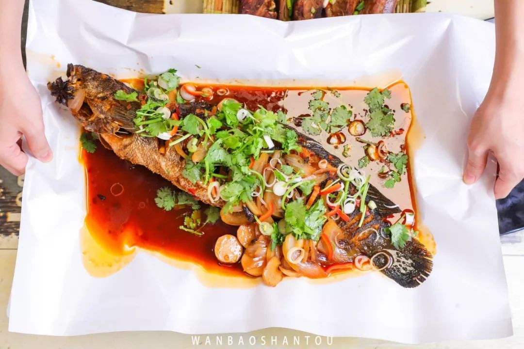 Grilled fish shop - shovel served and grilled fish with a steel tube Grilled fish shop - shovel served and grilled fish with a steel tube